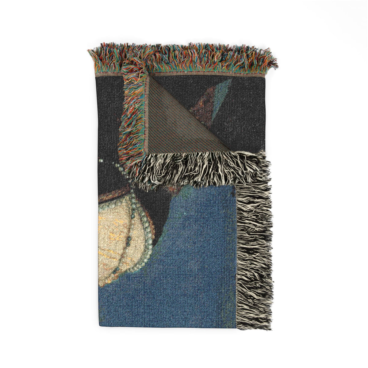 Portrait of a Woman woven throw blanket folded showing blue and dark panels with multicolor fringe detail