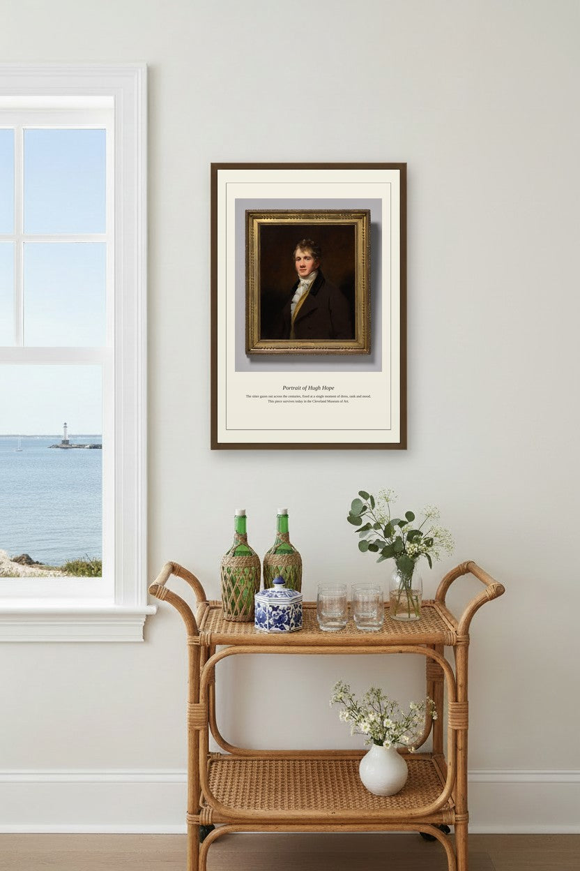 Portrait of Hugh Hope framed above a rattan bar cart near a window overlooking the water