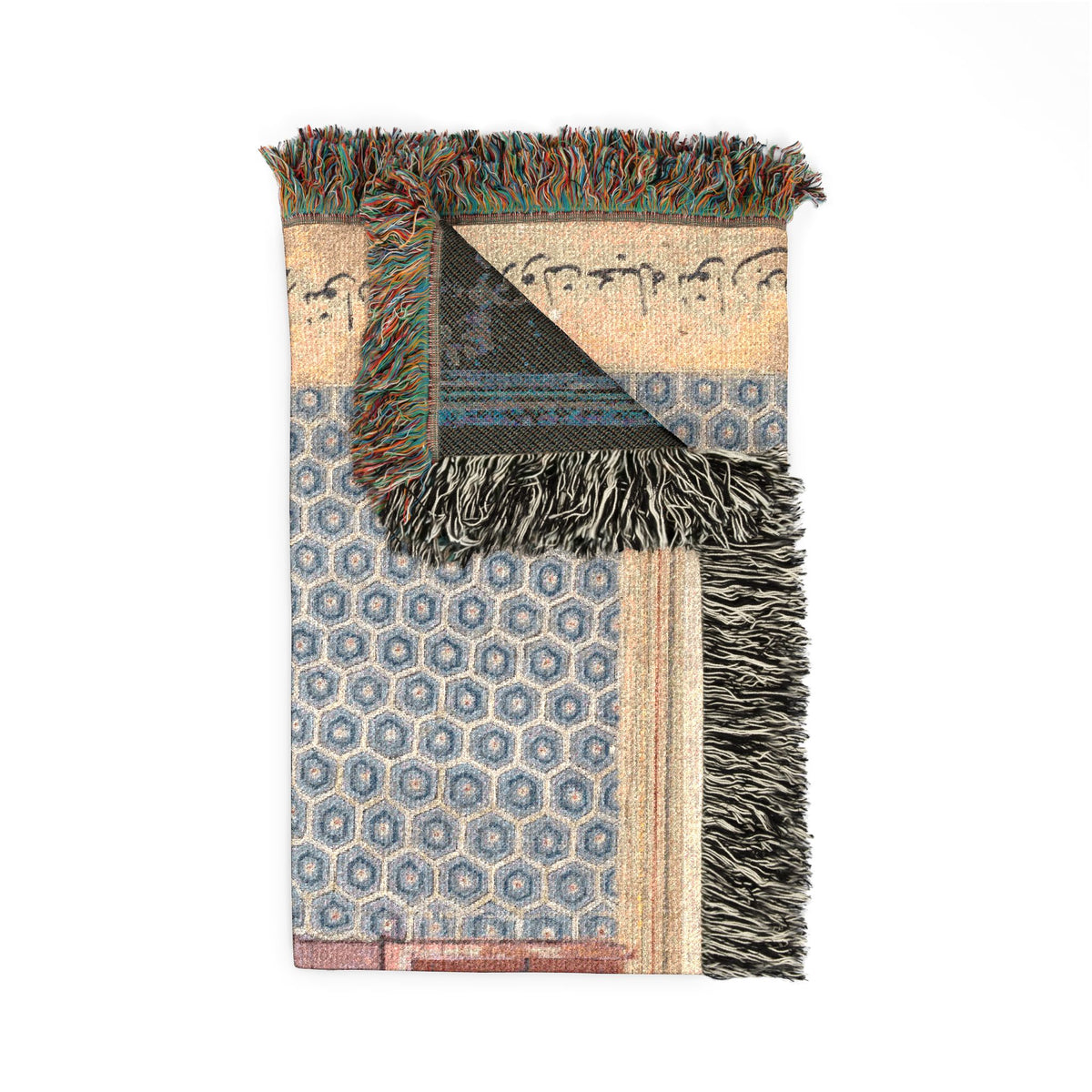 Seven-colored bird blanket corner fold, blue hexagonal tile woven pattern, Arabic script at top, dark reverse, fringe detail