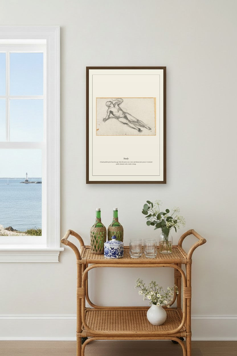 A framed art print featuring a classical sketch of a reclining figure, displayed on a light gray wall above a rattan bar cart with decorative bottles and flowers, next to a window overlooking the sea.