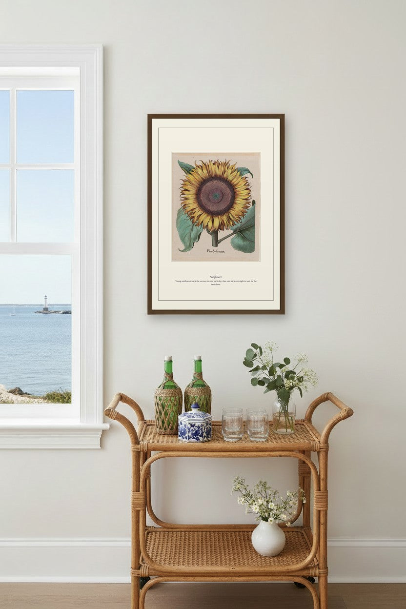 Sunflower engraving framed above a beige sectional sofa in a sunlit living room