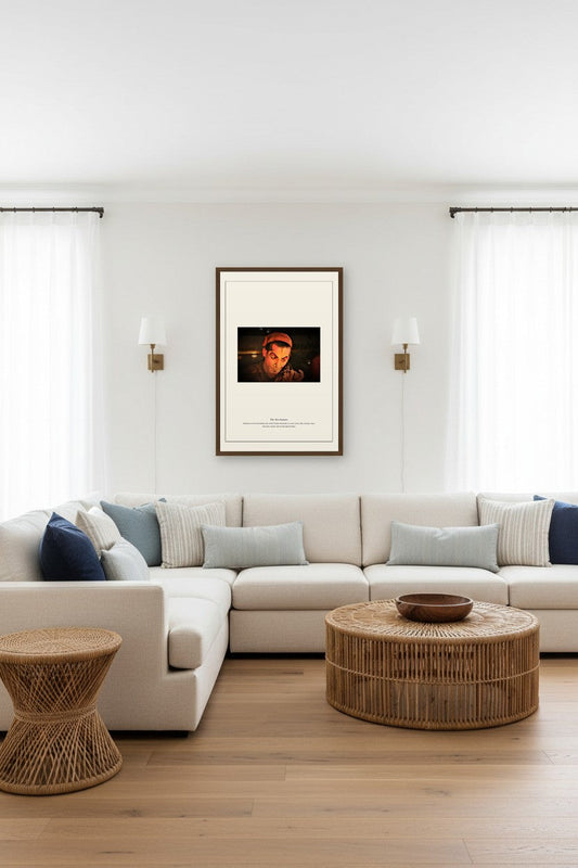 Framed The Ten Avatars print between wall sconces above a light sectional sofa