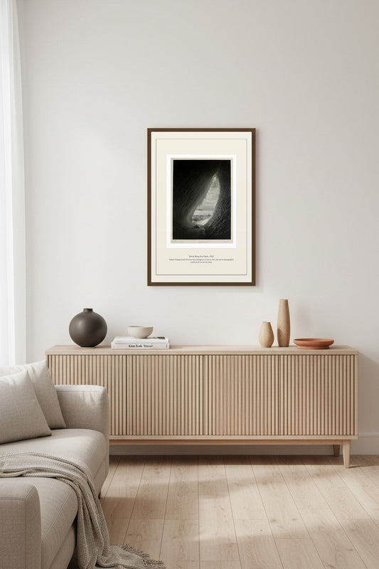 Terra Nova Ice Cave print above a light fluted wood sideboard in a warm living room