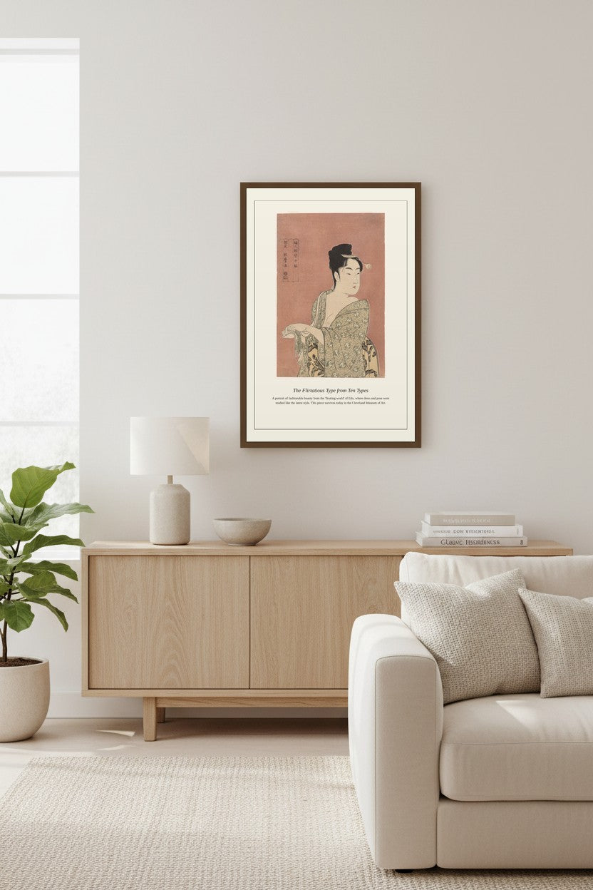 Framed Flirtatious Type portrait above a light wood sideboard beside a fiddle-leaf plant