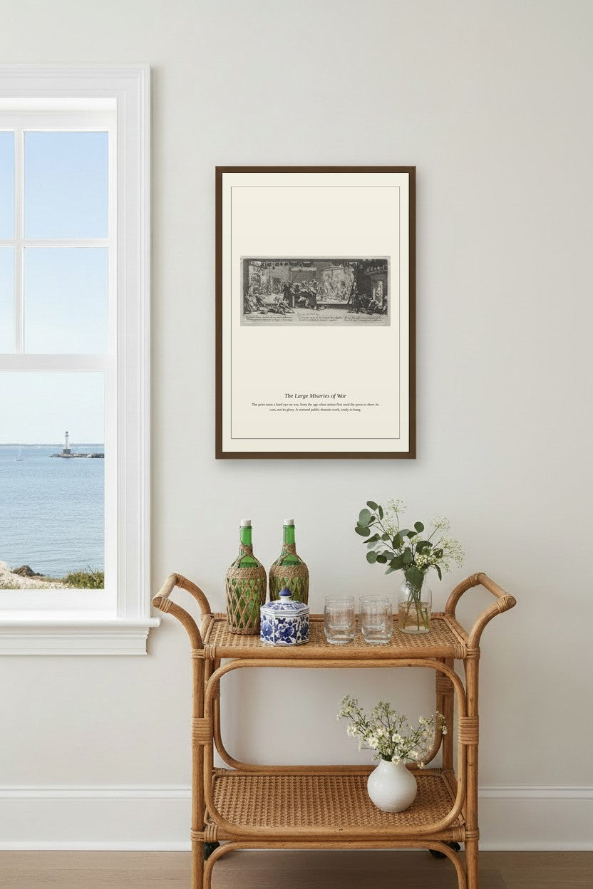A framed black and white art print titled 'The Longest Journey of Man' is displayed on a light gray wall above a rattan bar cart with decorative bottles and flowers, next to a window showing a sea view.