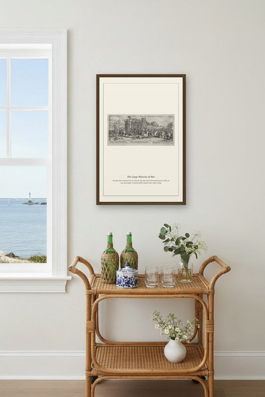 A framed black and white architectural print titled 'The Grand Hotel of Bali' is displayed on a light gray wall above a rattan bar cart with decorative bottles and flowers, next to a window showing a sea view.