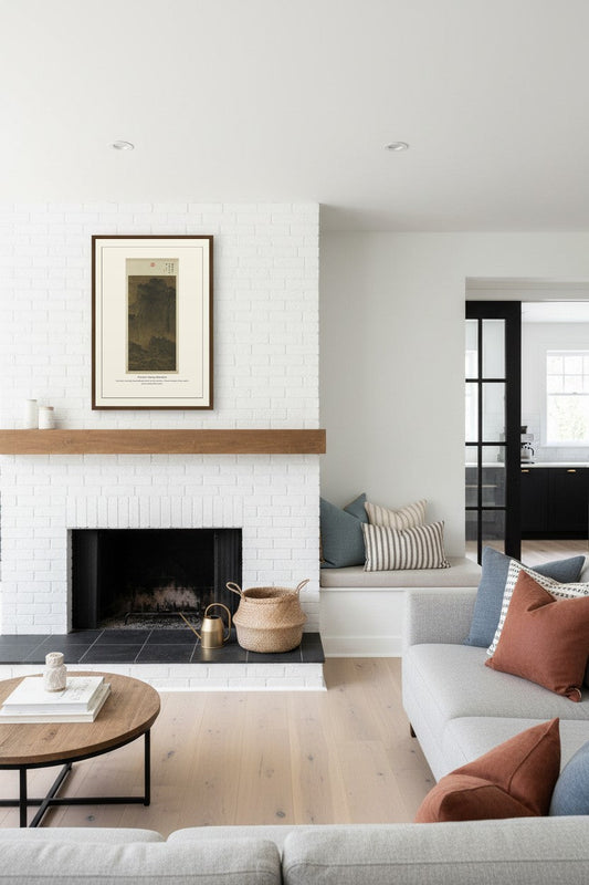 Travelers Among Mountains landscape print above a white brick fireplace mantel