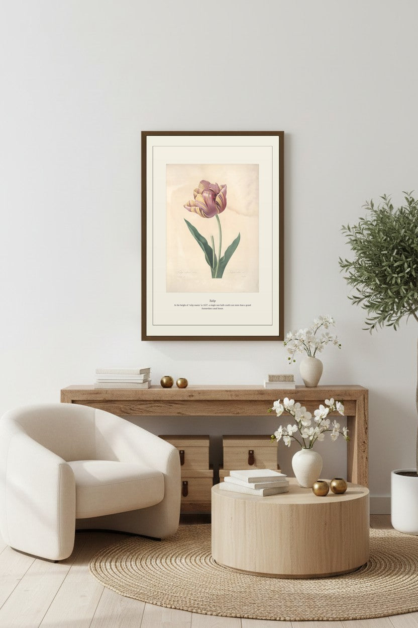 Tulip artwork framed above a wooden console with white blossoms, a round coffee table and rug