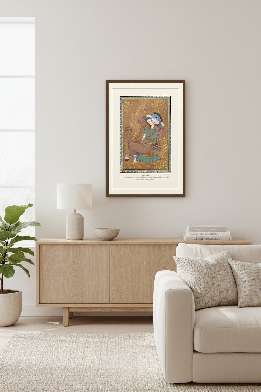Two Lovers framed print above a wooden sideboard with a potted fig tree