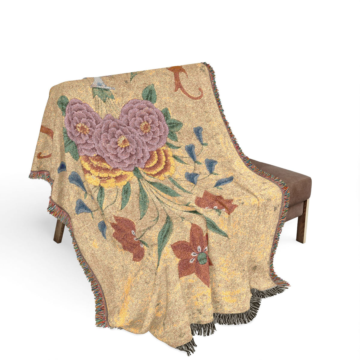 Vase with flower arrangement woven throw blanket on bench, sandy gold with purple roses and rust star flowers