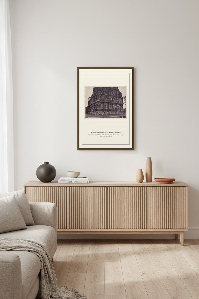 West and South Sides of the Vimana Walls photograph print framed above a low console table with vases and books