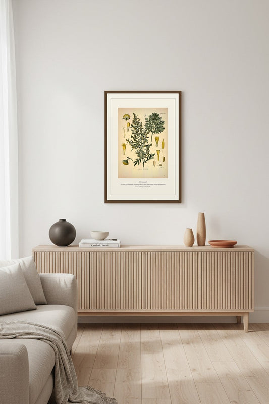Wormwood botanical print above a ribbed wood sideboard with ceramic vases in a neutral living room